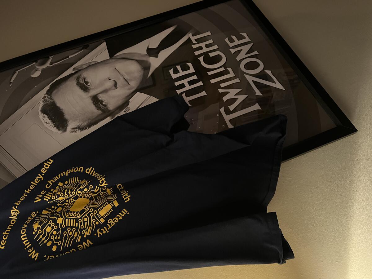 bIT tshirt draped over the Twilight Zone poster with Rod Serling.